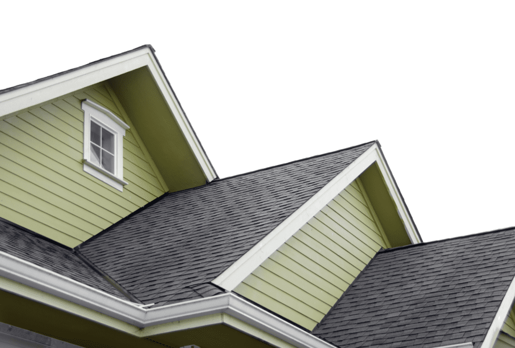 Low angle shot of a pea green house with grey shingles